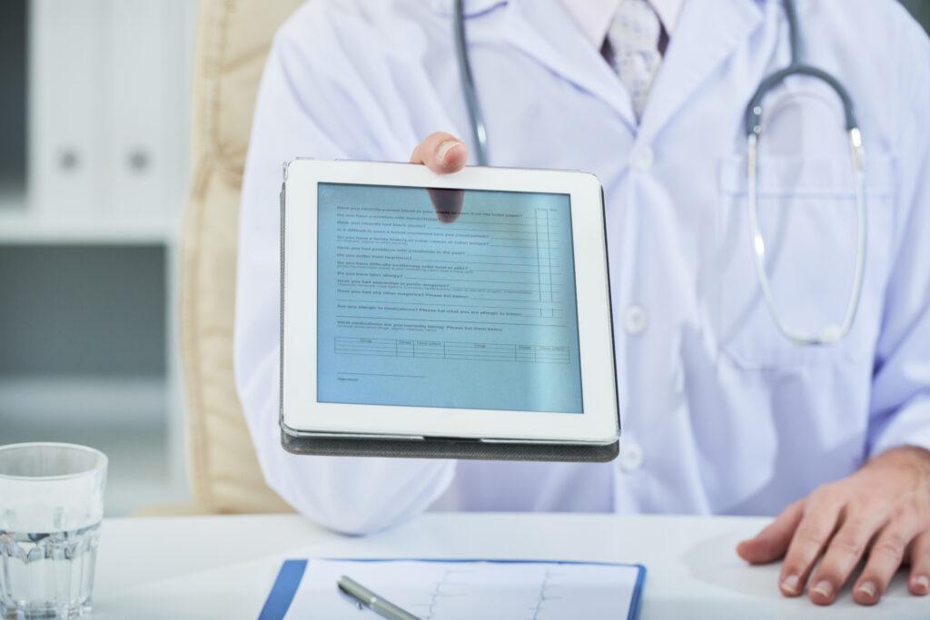 Physician completing credentialing paperwork